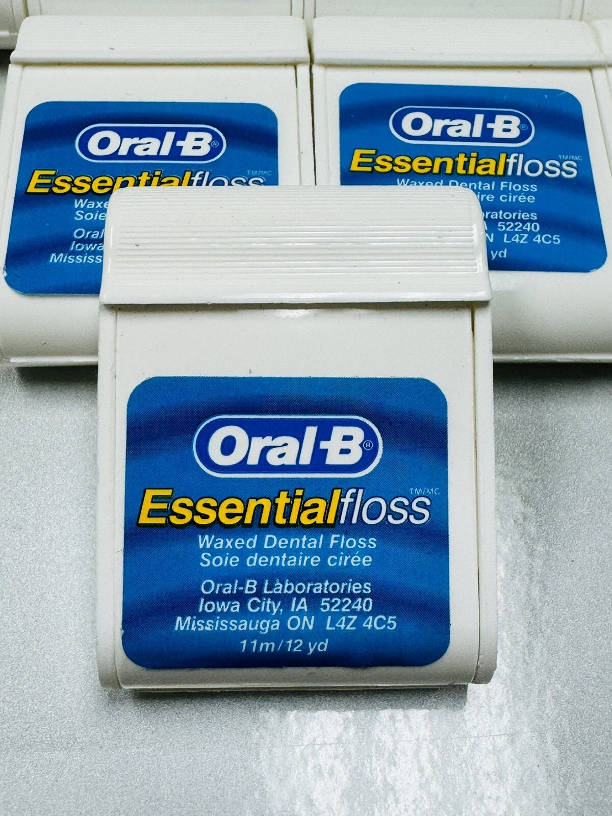 10 oral-b essential floss waxed 12 yards ea