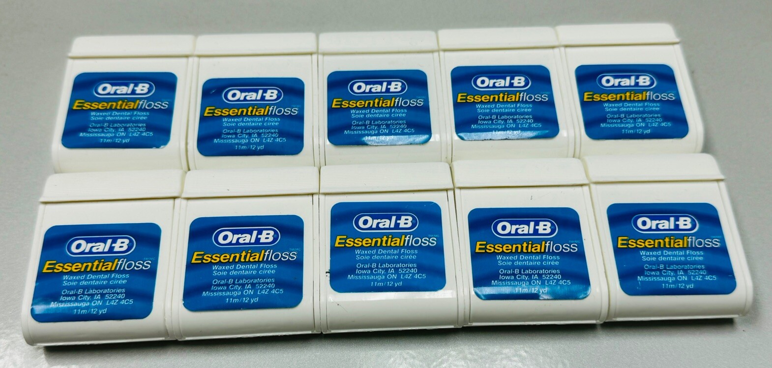 10 oral-b essential floss waxed 12 yards ea