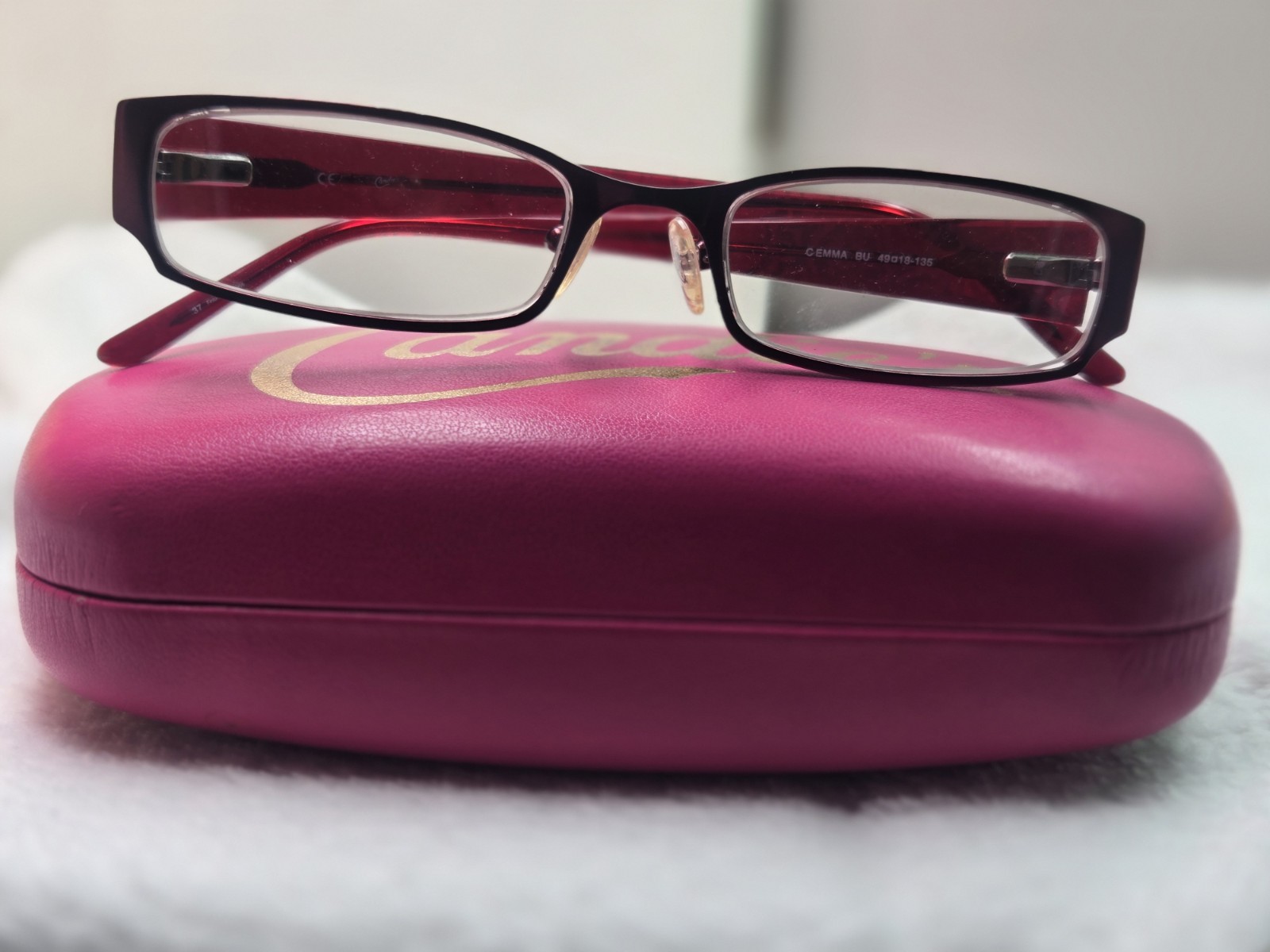 Candie’s branded Elisa burgundy plastic eyeglass frames with a matching hard…