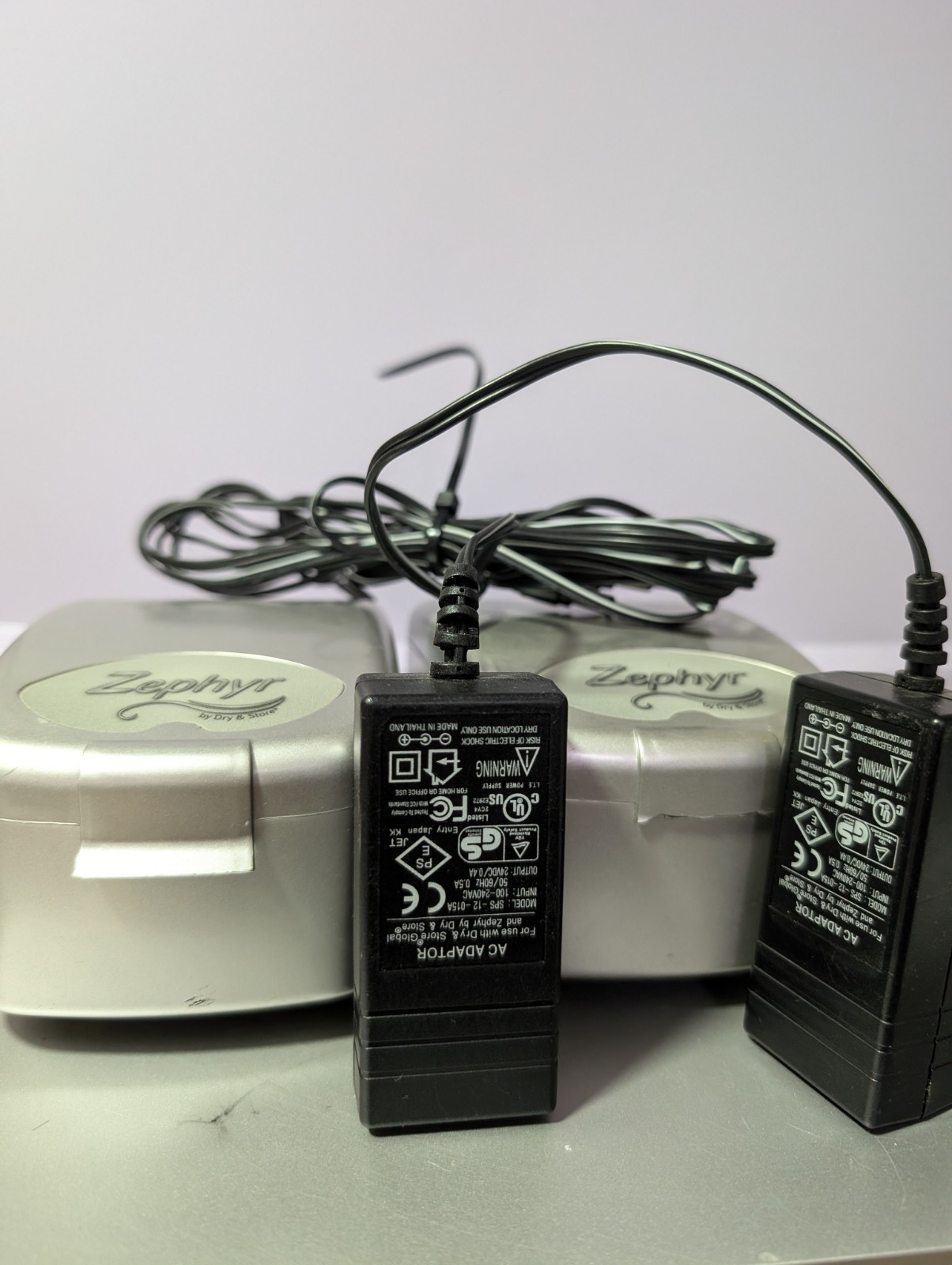 Two Zephyr by Dry & Store, an electronic dehumidifier